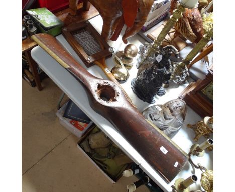 A Vintage mahogany propeller blade with brass edges, length 42" 