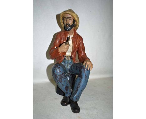 A large NAO figure as a Seated Sailor smoking a Pipe, brown jacket, blue trousers, C-27J to underside, 42cm high - boxed 