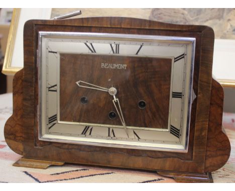 A Beaumont mantel clock, in Art Deco walnut case, three train gong striking movement, pendulum and key