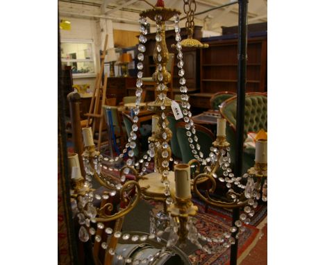 A Regency style gilt metal lantern with anthemion detail, together with a gilt metal six branch chandelier 