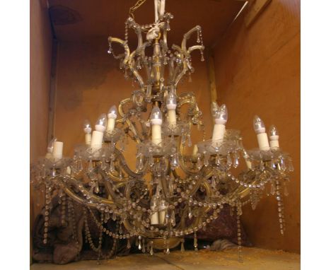 A large twenty four branch chandelier, with two tiers, with swags and drop pendants 113cm diameter, 118cm high Removed from t