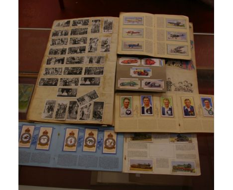 Cigarette cards; a mixed collection, some loose (part sorted), 19 'books', a large scrap book of mainly cards and a box of mo