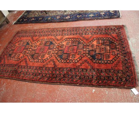 An Afghan carpet 225 x 110cm 