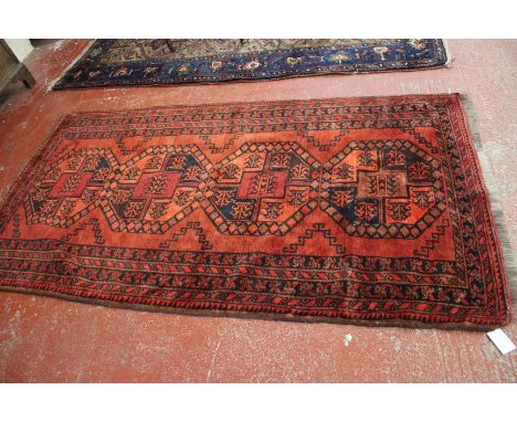 An Afghan carpet 225 x 110cm 