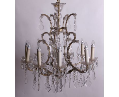 A ten branch chandelier each with drop pendants 100cm high, 75cm wide Removed from the Rolex Shop on Park Street