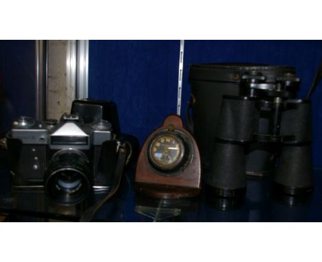 Cameras: a Cinerex cine camera (boxed) a Zenit-E camera in case, 16 x 50 binoculars in case, a Smith car clock on mahogany st