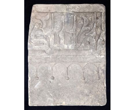 A fine 10-11th century Egyptian Fatimid carved stucco tile with large Kufic calligraphy, 27.5cm x 21cm