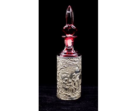 A late Victorian silver bottle holder, the cylindrical holder chased with 18th Century Ladies seated by a pedestal with Gentl