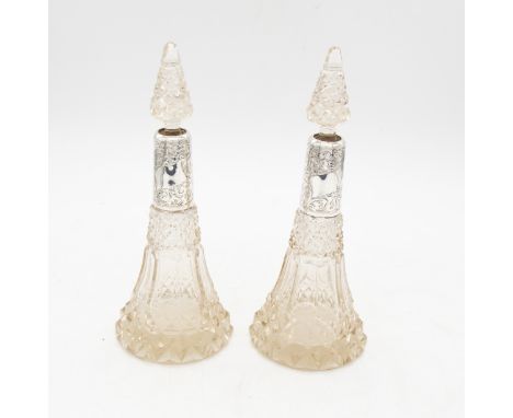 A pair of Edwardian silver mounted hob nail cut glass trumpet shaped scent bottles and stoppers, the silver collars engraved 