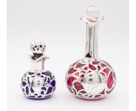 An early 20th Century white metal mounted onion shaped ruby glass scent bottle and stopper, the central panel engraved ROSE t