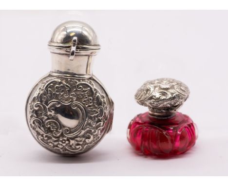 A late Victorian silver scent bottle holder and cover, the body chased with scrolling foliage with plain collar and hinged co