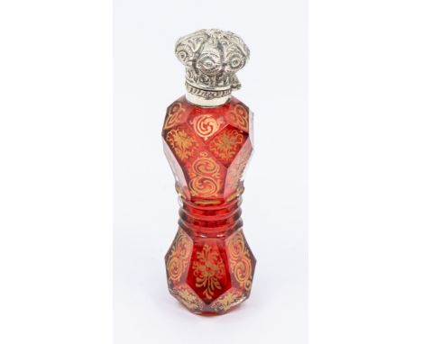 A 19th Century Continental facet cut waisted ruby glass scent bottle decorated with gilt flowers and scrolls, with white meta