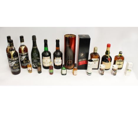 A collection of various alcohols and spirits to include; 2x Remy Martin champagne cognac in boxes, Triplice liquor, a Brut "R