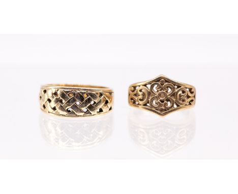 A 9ct gold ring with pierced scrolled decoration, width approx 12mm, size K, along with a a 9ct gold ring with pierced woven 