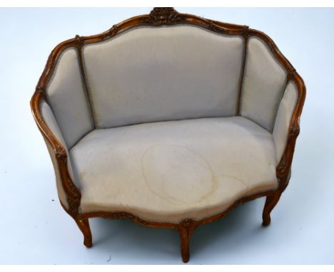 An early 20th century reproduction mahogany Regency-style parlour sofa chair with carved detail to the frame and a light blue