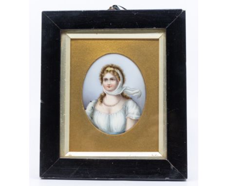 A late 19th Century Continental School probably German porcelain oval plaque, painted with a portrait of a Lady wearing pearl