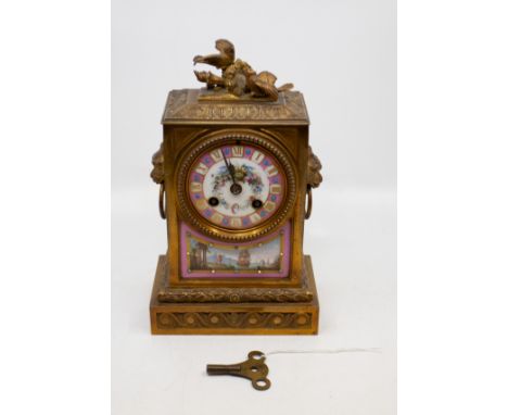 A 19th Century French gilt metal mounted mantle clock, the Sevres style Pompadour pink ground dial with gilt Roman Numerals p