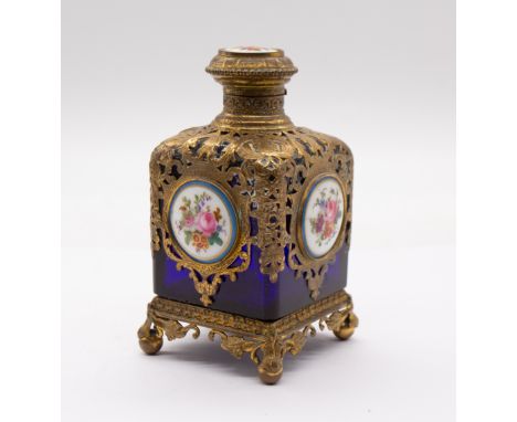 A 19th Century Palais Royal cobalt blue gilt metal mounted scent bottle and cover, the upper section over laid with scrolling