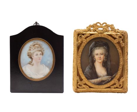 Continental School (19th Century) Portrait miniature of a lady wearing a mantilla, pearl earrings  oval, 9cm long, gilt frame