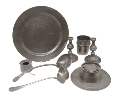 A small collection of 19th century pewter to include: a circular capstan inkwell with ribbed design; a pair of candlesticks; 
