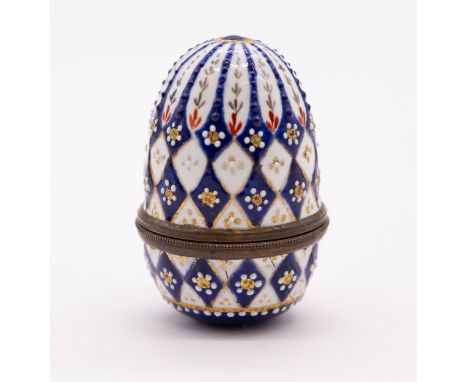An 18th Century South Staffordshire metal mounted enamel ovoid nutmeg grater and detachable cover, circa 1790, the white grou