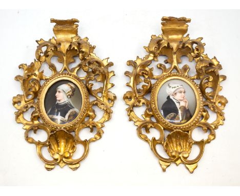 A pair of 19th Century Continental probably German porcelain oval painted plaques, the profile portraits depicting noblewomen