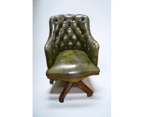1980s' bottle green, leatherette, button-back, swivel desk chair with mahogany castor supports - damage to back of back rest.