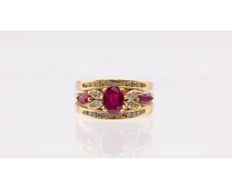 A ruby and diamond 18ct gold ring, comprising an oval mixed cut ruby to the centre within a flower arrangement of marquise cu