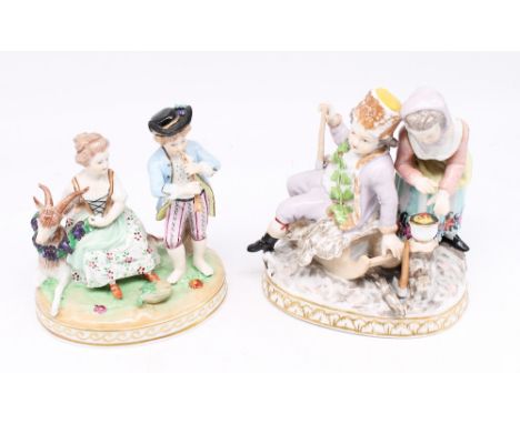 Dresden porcelain: a 20th century figural group depicting a young lady with a goat and a young boy playing a clarinet. Marked
