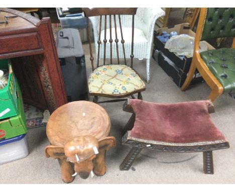 A carved hardwood seat in the form of an elephant, a carved footstool and stickback chair with tapestry seat (3). Shipping ca