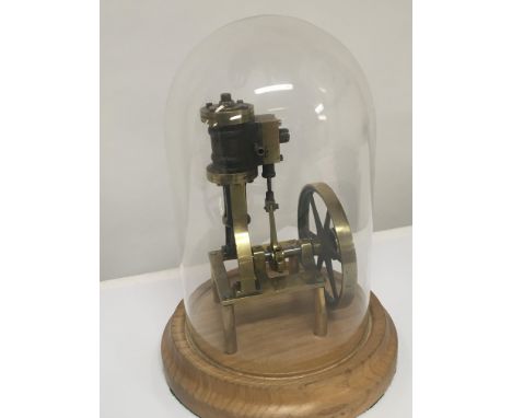 A model brass functional static traction engine under a glass dome. Height 24cm