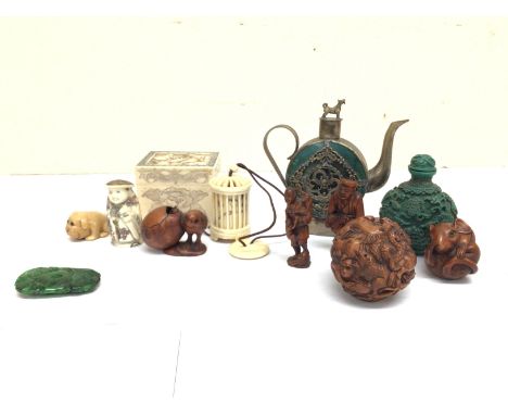 An oriental collection of Netsuke including a water dropper, snuff bottle, carving statues etc. postage cat B