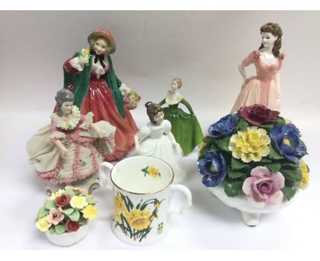 Five ceramic figures of ladies comprising Doulton and Coalport examples plus two posies and a loving cup (8). Shipping catego