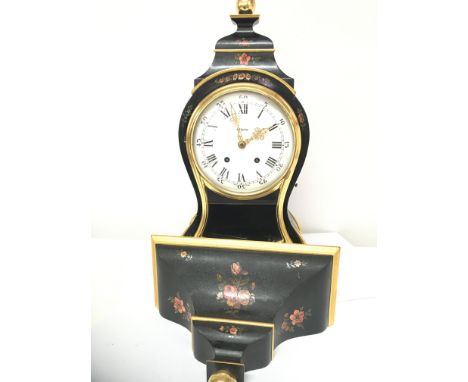 A Continental black lacquer and painted bracket clock with key and pendulum. Hight of clock Hight 53cm