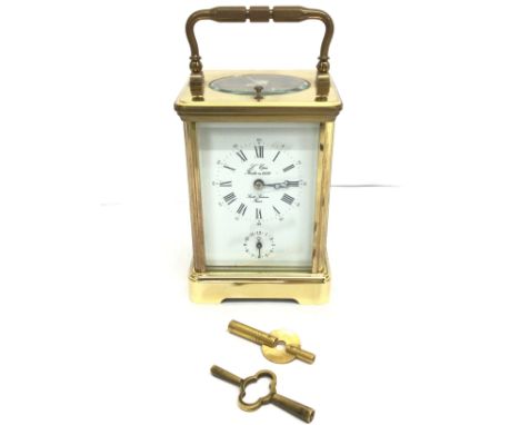 L Epee striking/repeater carriage clock. With key. Approximately 15cm tall. Postage cat D