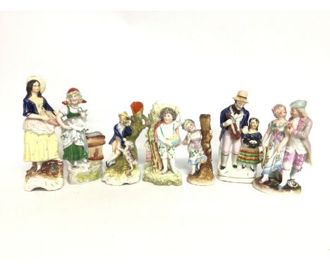 A collection of Staffordshire figures and other, ranging from heights of 15 to 23cm tall. postage cat D NO RESERVE