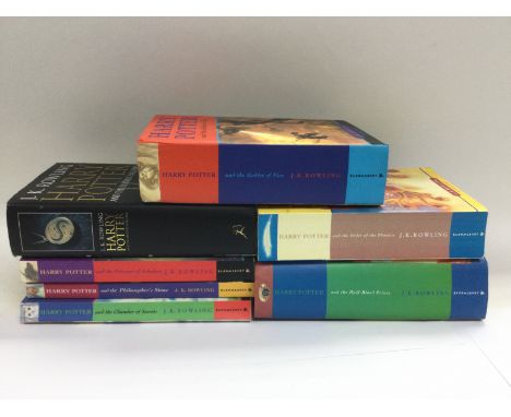 Seven Harry Potter books including three first editions. Shipping category D.