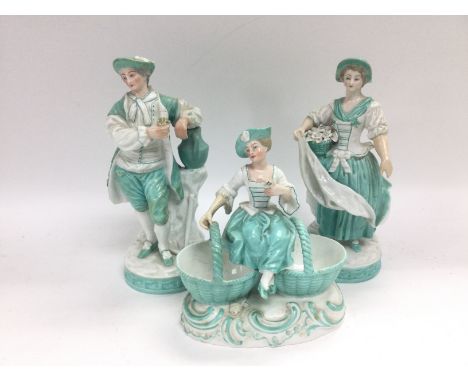 A Continental porcelain group comprising a seated maiden with two flower baskets plus two further standing figures (3). Shipp