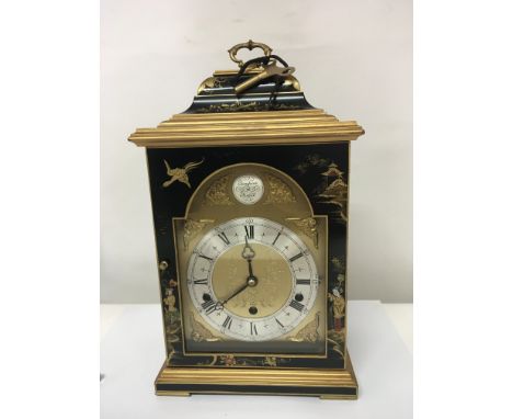 A Quality black lacquer Chinoiserie mantel clock maker Elliot made in England the brass dial with a silver chapter ring. With