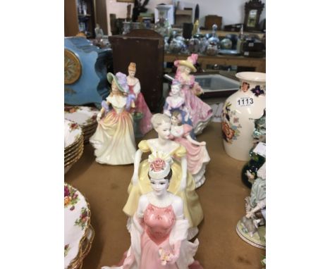 A Collection of seven Royal Doulton and Coalport figures.