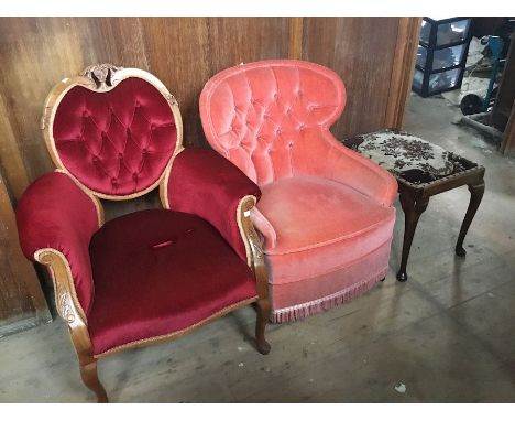 A late Victorian walnut ladies armchair, carved back surround and arm supports, button backed and upholstered in red velvet a