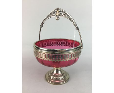 CRANBERRY GLASS COMPORT, with silver plated mount, on stem with round base, 17cm high, along with a jug with bird motif decor