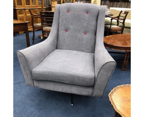 CONTEMPORARY ARMCHAIR, upholstered in grey fabric and with red button details, on swivel base