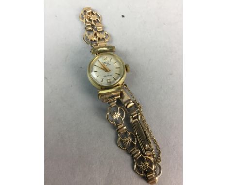 LADY'S BRITIX MANUAL WIND WATCH, gold plated, on a nine carat gold bracelet strap, 11.4g gross