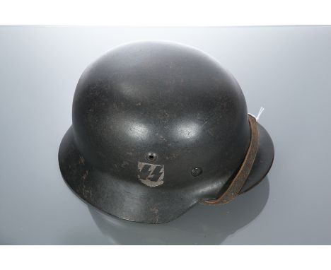 THIRD REICH WAFFEN SS DOUBLE DECAL STEEL HELMET field painted in black, rim numbered 2844, tan leather liner marked '57', wit