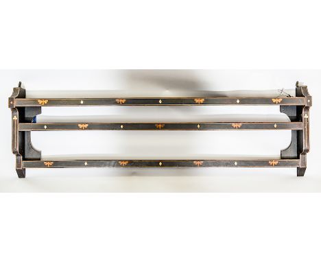 ART NOUVEAU WALL MOUNTING PLATE RACK
the ebonised oak frame inset with repeating dragonfly motifs and mother of pearl lozenge