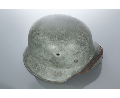 THIRD REICH EARLY RURAL POLICE STEEL HELMET
the grey field with one visible decal, numbered 4284, with tan leather lining mar