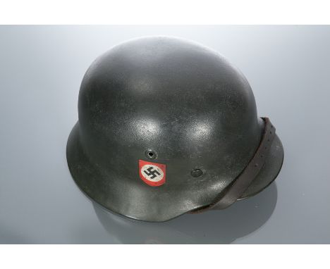 THIRD REICH M40 COMBAT POLICE HELMET
with decals, the helmet with swastika and National Socialist Party insignia, with brown 