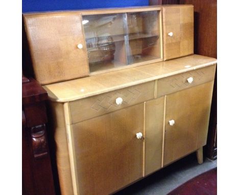 A light oak sideboard. L123cm D49cm H126cm.