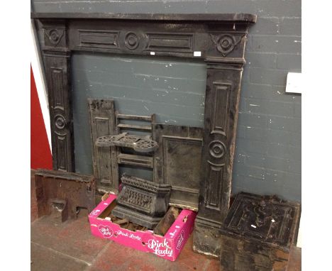 A late Victorian/Edwardian cast iron fire surround and stove.